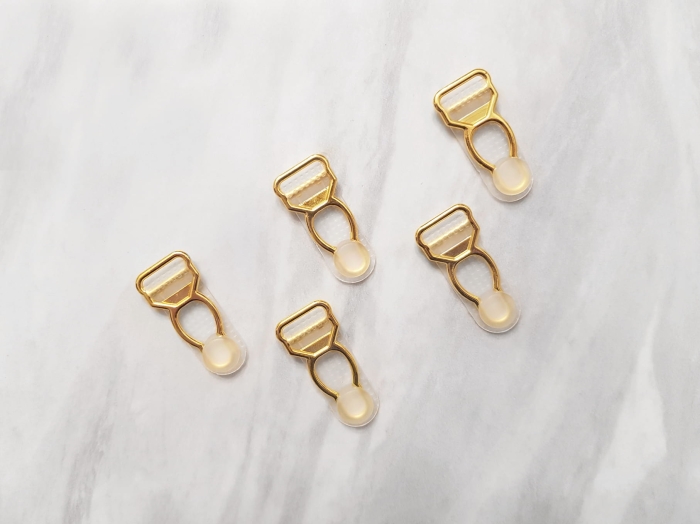 Paczka 40 złotych żabek do pończoch silikonowych o szerokości 12 mm